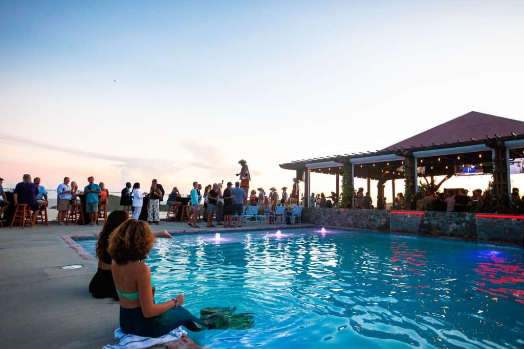Poolside view at Blackbeard's Castle with guests enjoying the sunset.