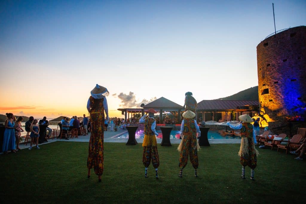 Traditional stilt dancers performing at sunset at Blackbeard's Castle, St. Thomas.