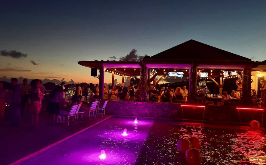 Poolside gazebo bar glowing at sunset at Blackbeard's Castle